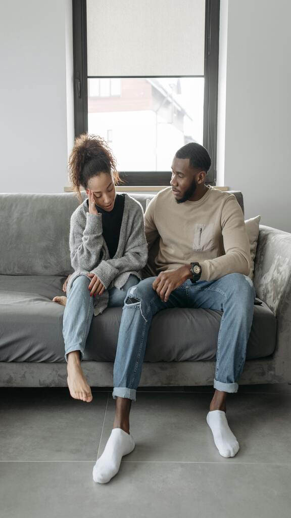 Couple facing each other in conversation with open body language and attentiveness
